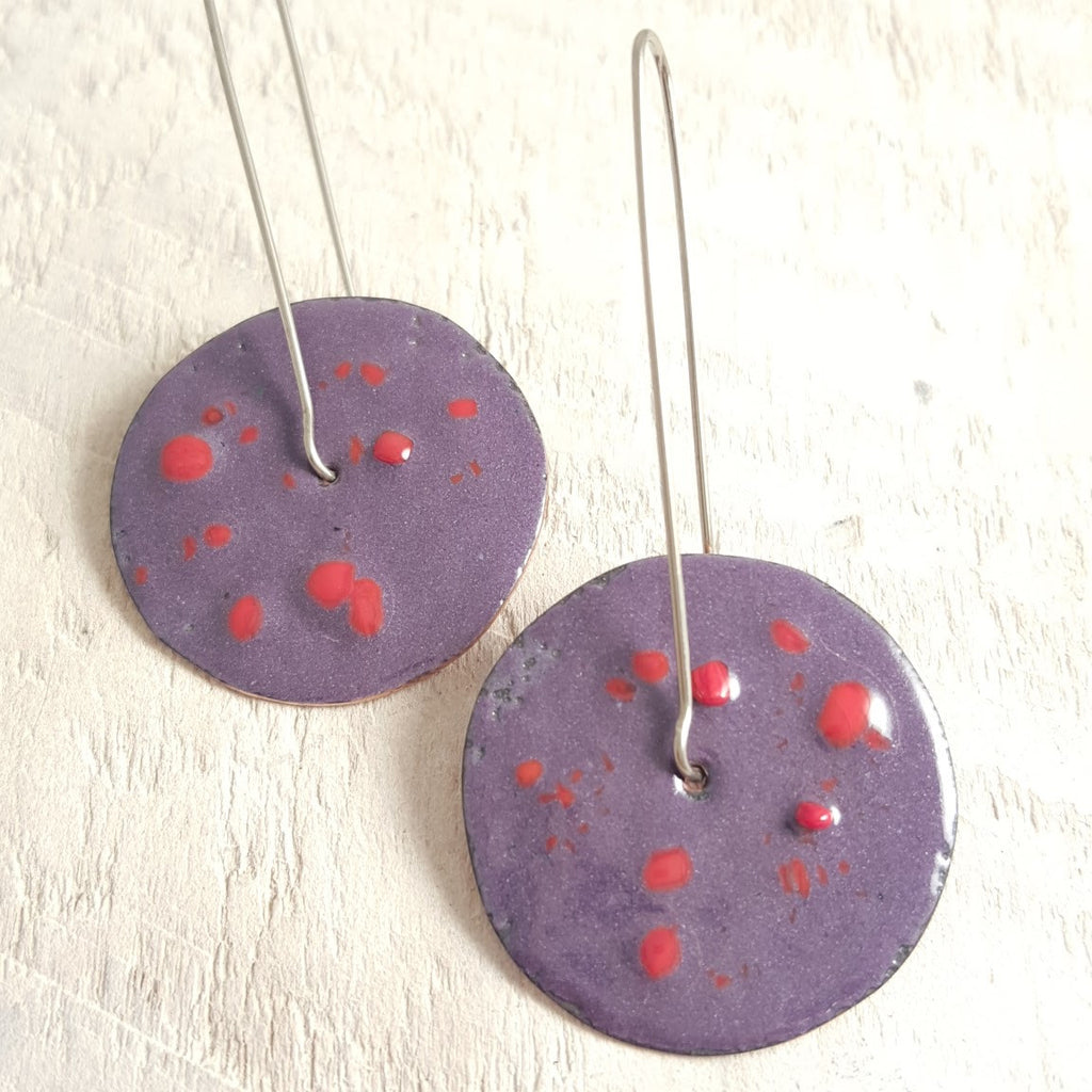 Purple enameled copper earrings with red dots.
