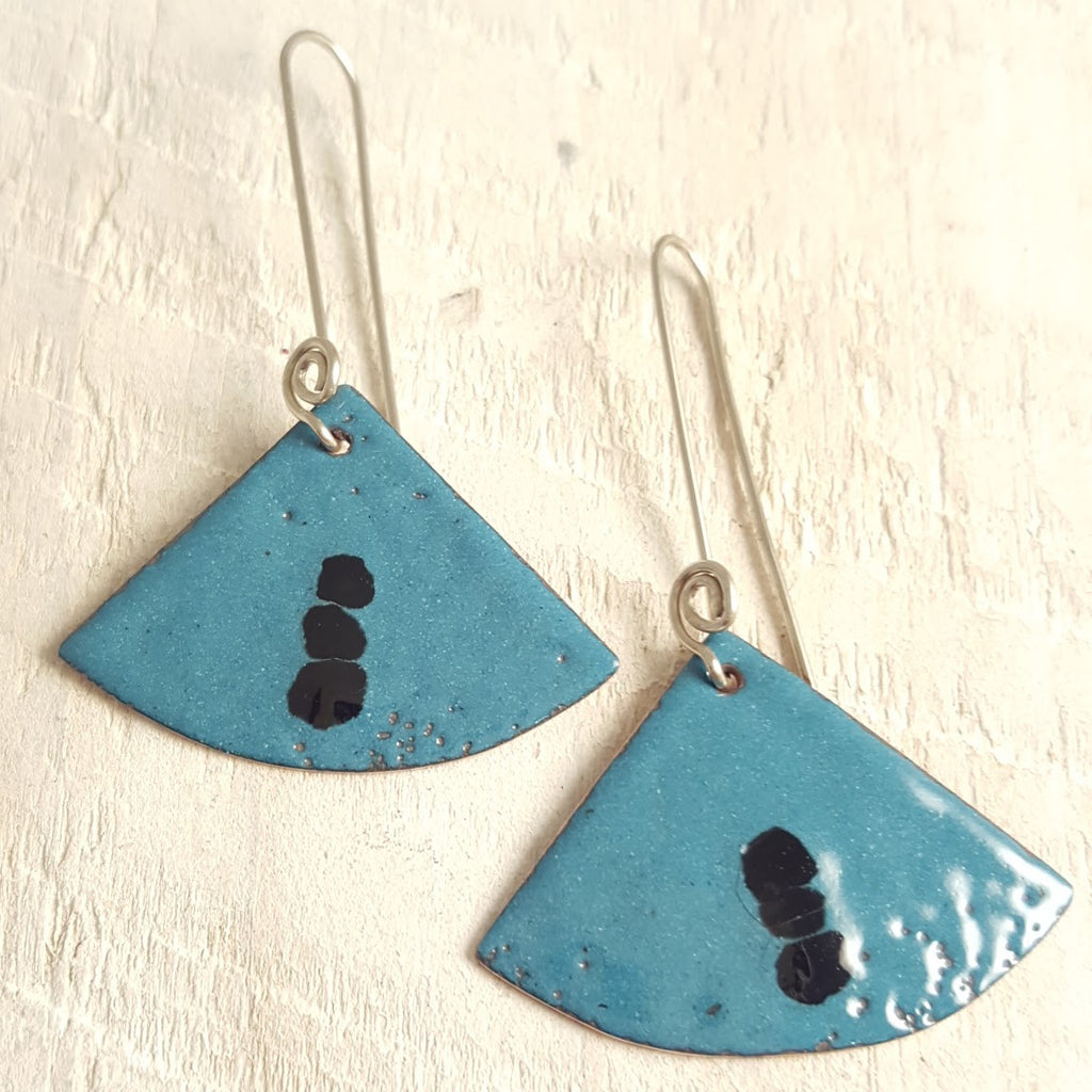 Turquoise enameled copper earrings with black accents.