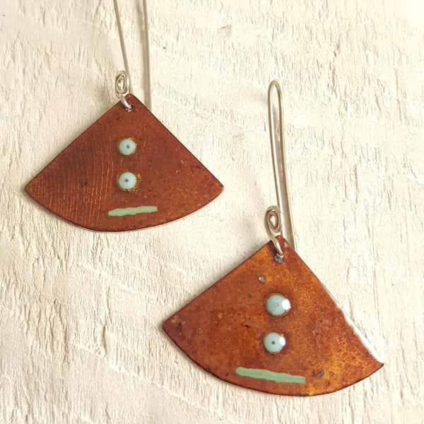 Translucent brown enameled copper earrings with light blue green accents.