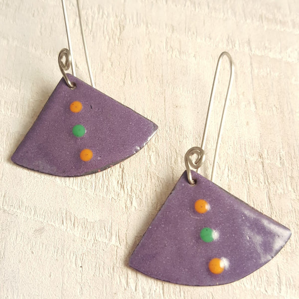 Purple enameled copper earrings with orange and green dots.