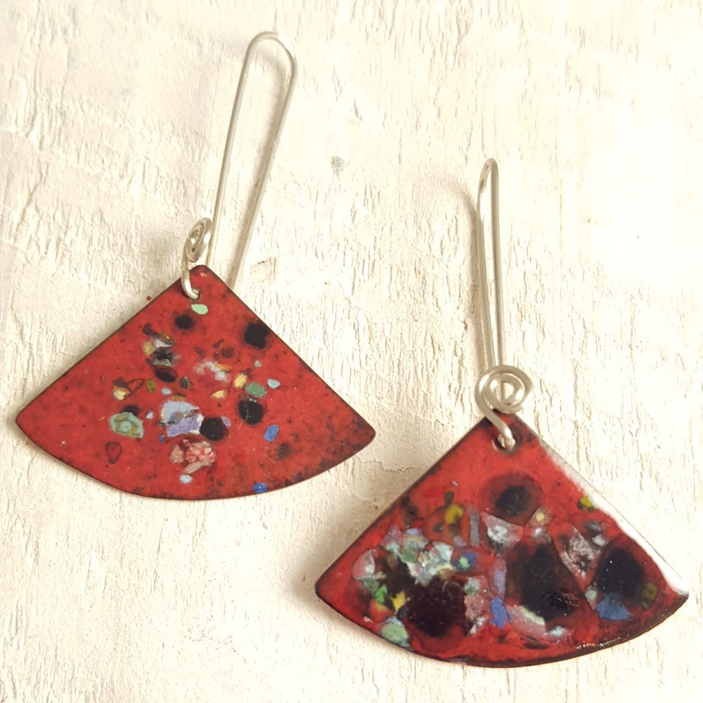 Dark red enameled copper earrings with speckled accents.