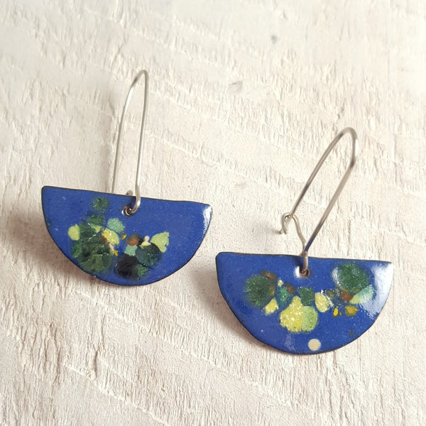 Blue enameled copper earrings with green accents.