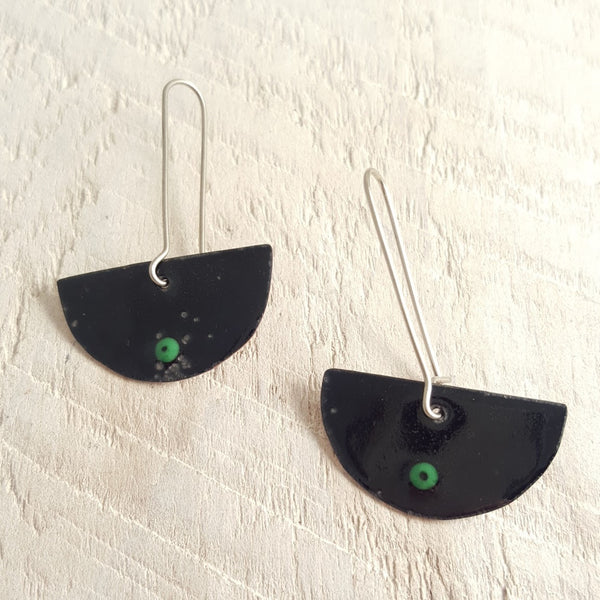 Black enameled copper earrings with green accent.