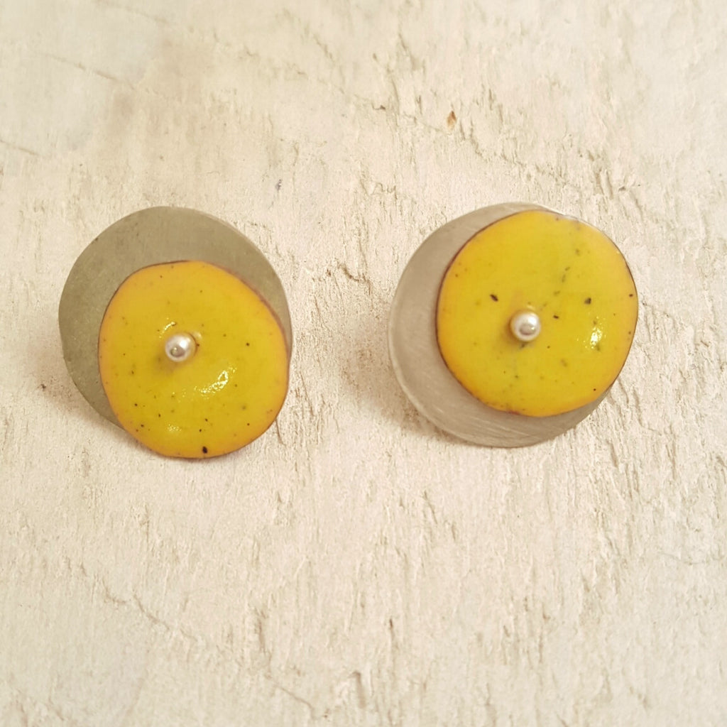 Yellow enameled copper studs.