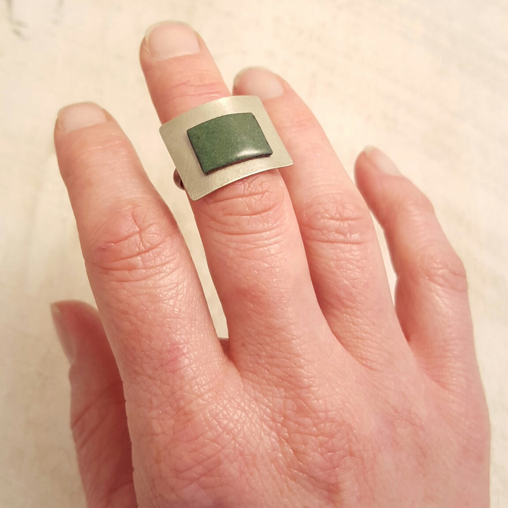 Green enameled copper ring.