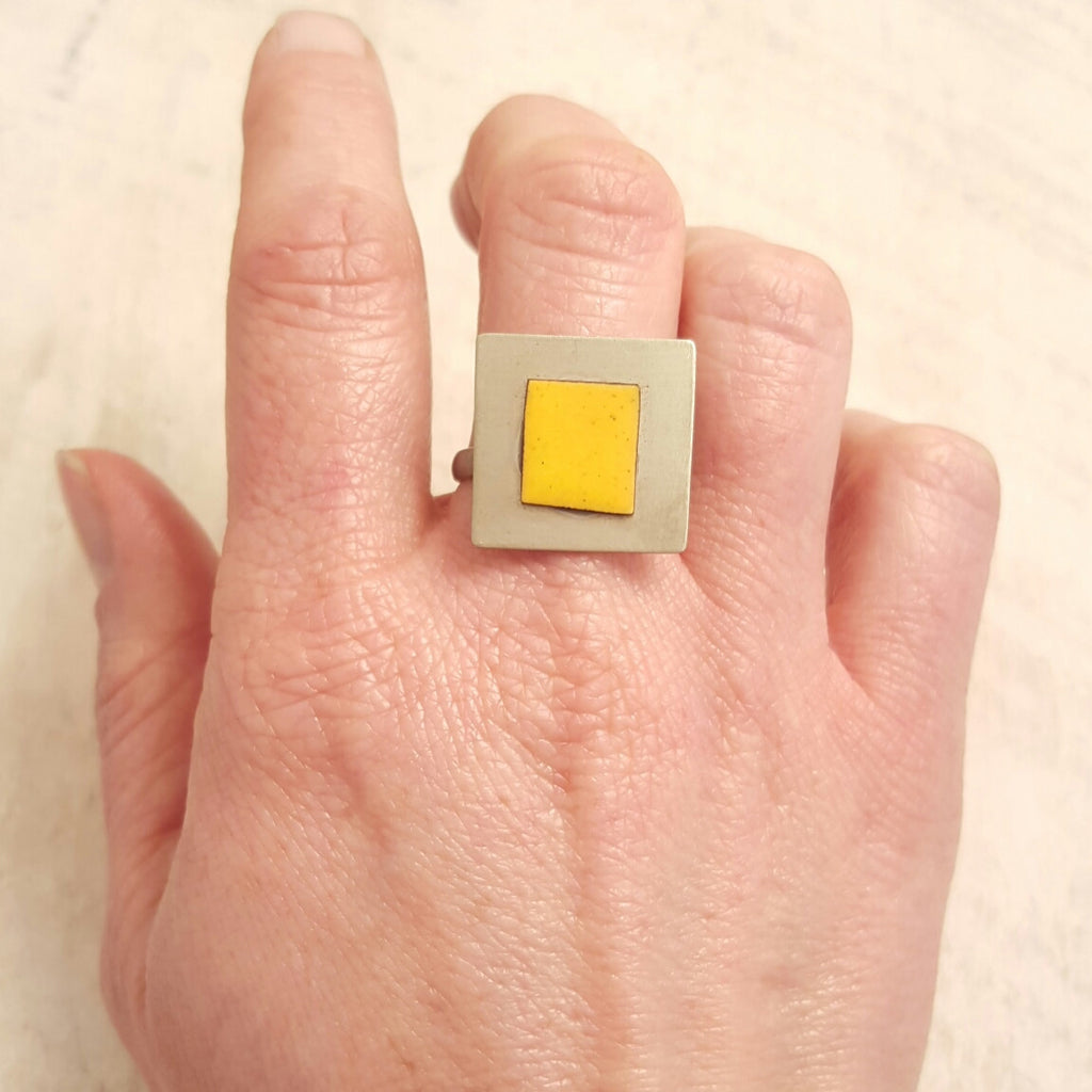 Yellow enameled copper ring.