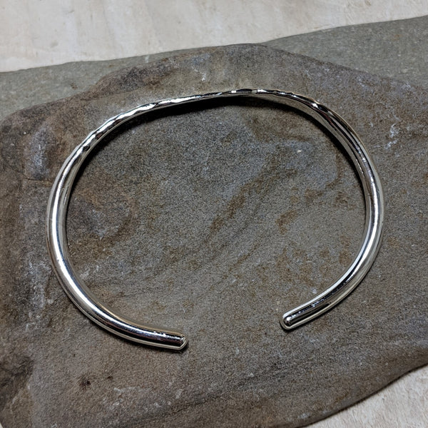 side view of silver hammered cuff