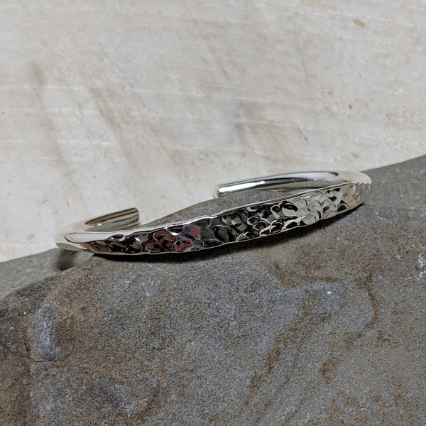 angled view of silver hammered cuff