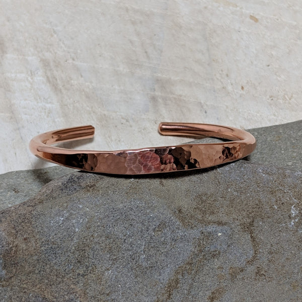 angled view of hammered copper cuff