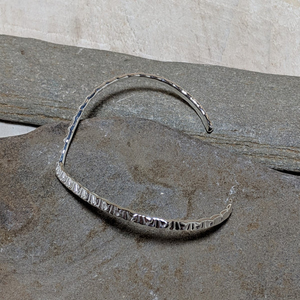 side view of silver naveen v cuff