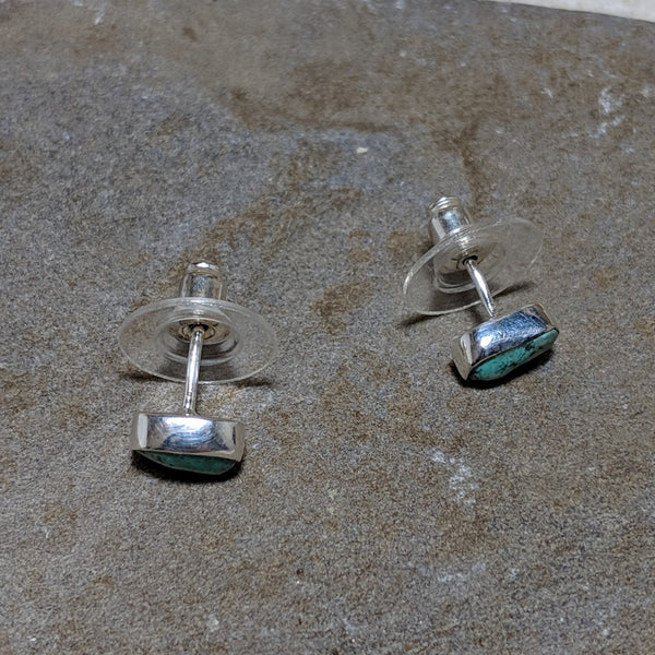 side view of turquoise rocha studs in silver