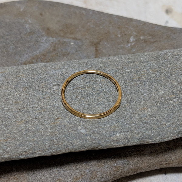 side view of quinn plain stacking ring in gold color