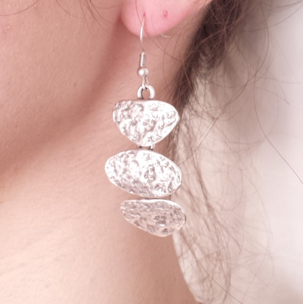pebbles earrings on model