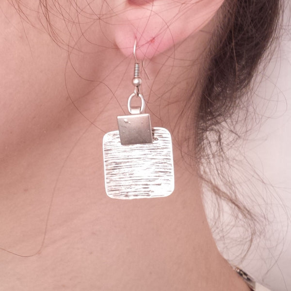 toast earrings on model