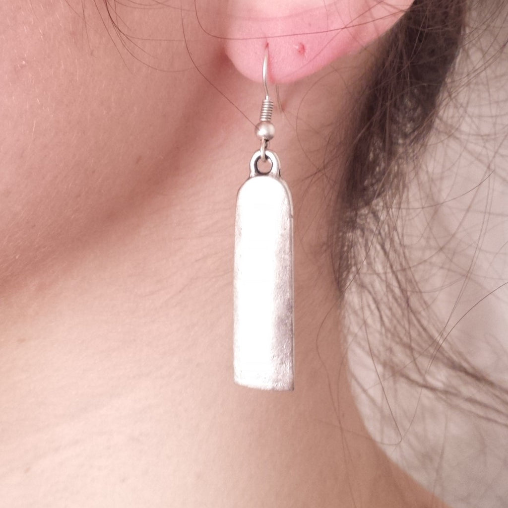 simplicity earrings on model